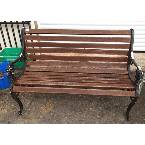 225 - A Garden Bench with Metal Lion Motif Ends