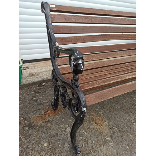 225 - A Garden Bench with Metal Lion Motif Ends