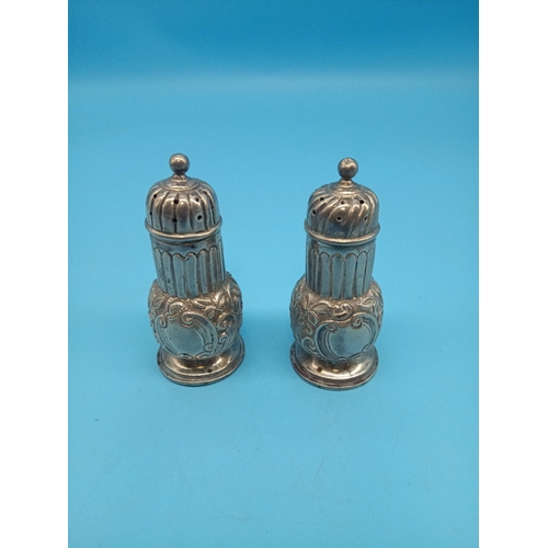 487 - A Pair of Repousse Silver Salt and Pepper Pots