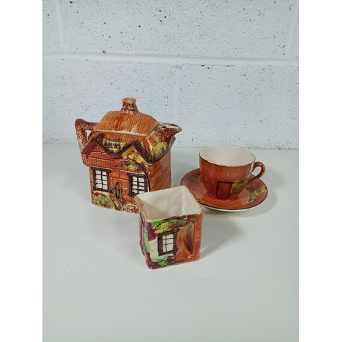 537 - A Price Bros Cottageware Tea Pot, Cup and Milk Jug