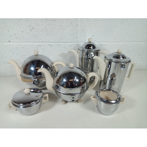 412 - A Collection of Art Deco Insulated Teapots etc.