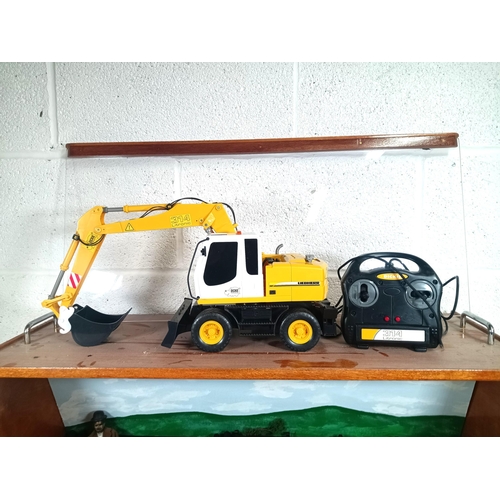 1117 - A Metal Model 10 Wheel Low Loader in Display Case with R.C Model Liebherr Dicke Toy Digger