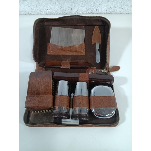 868B - A Vintage Gentleman's Leather Cased Travel Vanity Set