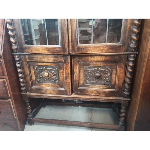 889 - Antique Elm Display Cabinet with Leaded Glass Doors, Ornately Carved with Barley Twist Legs and Fron... 