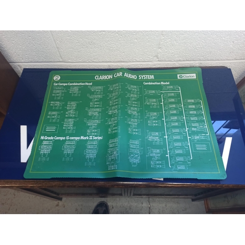 977 - A Plastic Wall Sign - Service and Warranty and a Clarion Car Audio Sign 73cm x 50 cm and 101cm x 54c... 