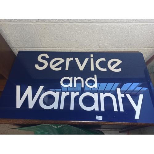 977 - A Plastic Wall Sign - Service and Warranty and a Clarion Car Audio Sign 73cm x 50 cm and 101cm x 54c... 