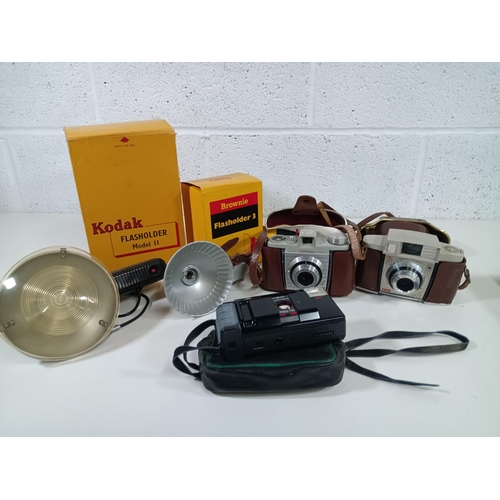 551 - 2 x Kodak Coloursnap Cameras and Flash Holders