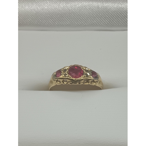 455 - An 18ct Gold and Ruby Ring with Diamond Accents