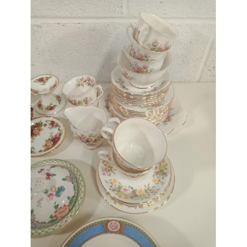 872 - A Qty of bone china part tea services including Royal Albert Country Roses, Royal Albert, Colclough ... 