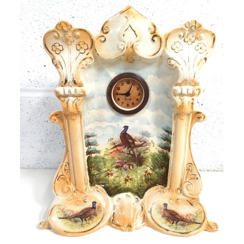 1039c - A Pottery Mercedes Clock with Pheasants Motif