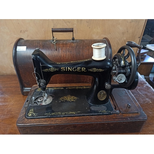 605 - Singer Sewing Machine in Oak Case with Key