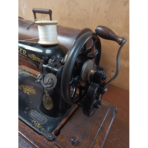 605 - Singer Sewing Machine in Oak Case with Key