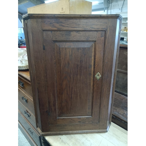 596 - An Antique Oak Corner Wall Cupboard with Brass Lock Plate