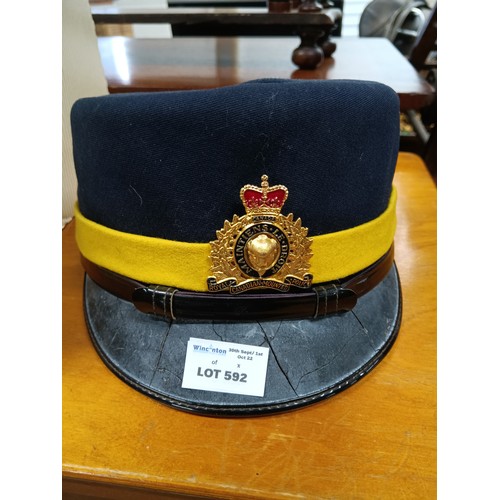 592 - A Royal Canadian Mounted Police Cap ( some cracking to visor)