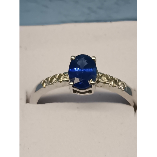 432 - A 9ct White Gold and Sapphire Ring with Diamond Accents 1.4 Grams, Size N/O