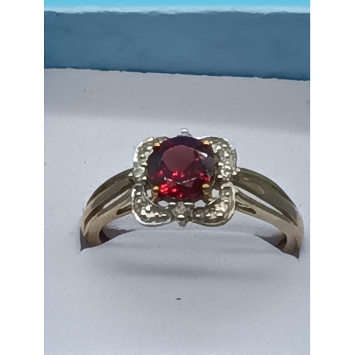 452 - 9ct Yellow Gold and Ruby Ring Surrounded by Diamonds 2.3 Grams