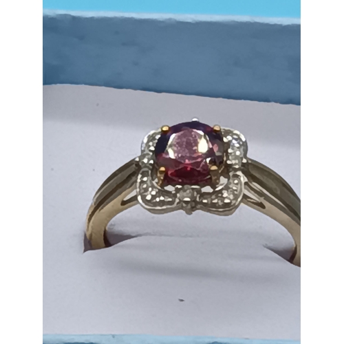 452 - 9ct Yellow Gold and Ruby Ring Surrounded by Diamonds 2.3 Grams