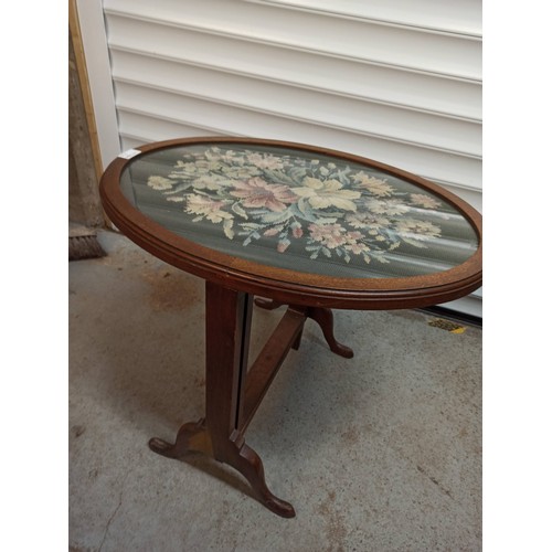 787 - An Antique Tapestry Tilt Top Oval Table