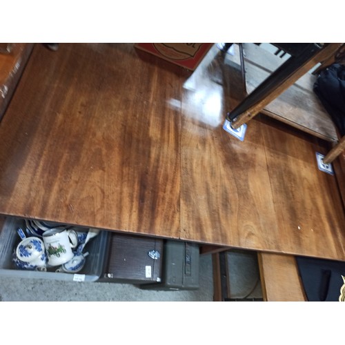 828 - A Mahogany Drop Leaf Table 70 x 130 x 98cm