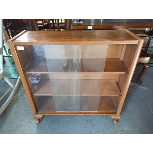 264B - **Royal British Legion Lot** An Oak bookcase with glass sliding doors - 80 x 78 x 25 (split to top a... 