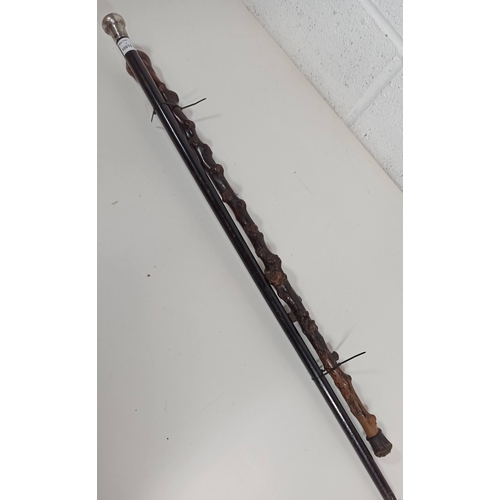 378 - A Pair of  Silver Topped walking sticks -