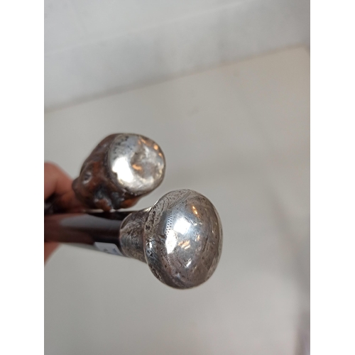 378 - A Pair of  Silver Topped walking sticks -