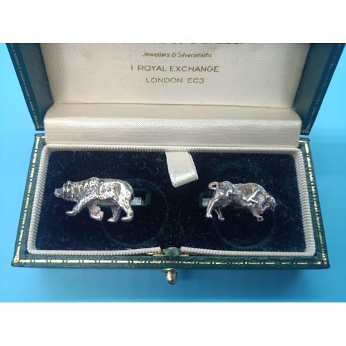 521 - A pair of Bear & Bull Cufflinks