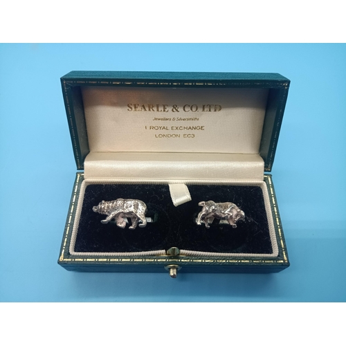 521 - A pair of Bear & Bull Cufflinks