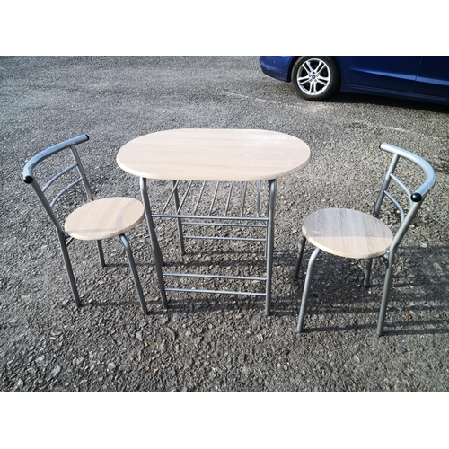 625 - A Compact metal framed table and chairs