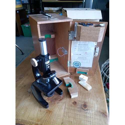 857C - A Cased Olympus 4743 Microscope