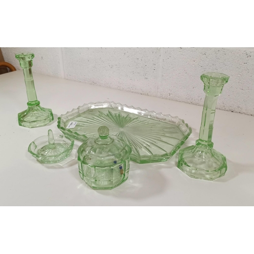 657 - A Uranium Glass Dressing Table Set