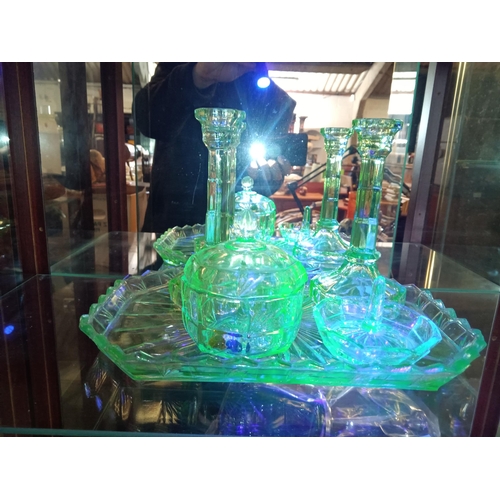 657 - A Uranium Glass Dressing Table Set