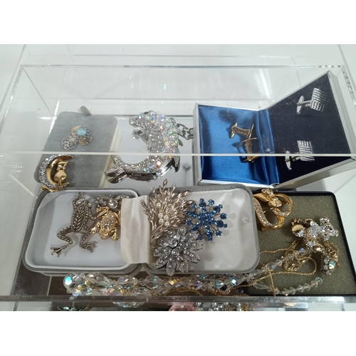 799 - A Perspex Jewellery box and contents