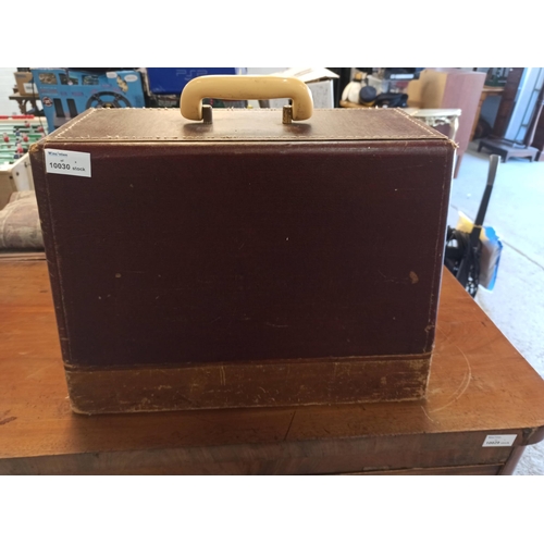 697 - A Singer Sewing Machine with side tray and leather case