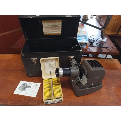 772 - An Alvis Star projector in case with slides and instructions