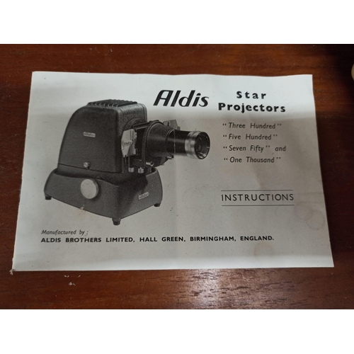 772 - An Alvis Star projector in case with slides and instructions