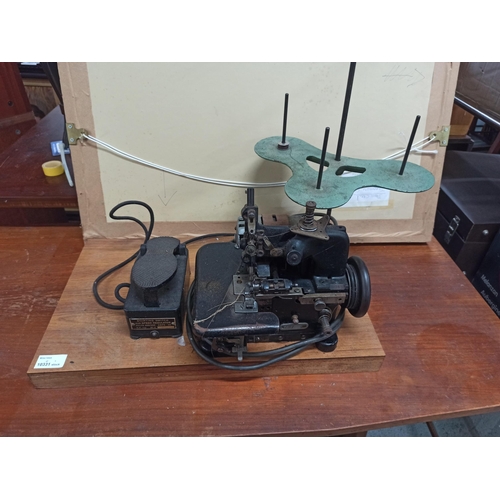 698 - A Vintage Tailers Sewing Machine