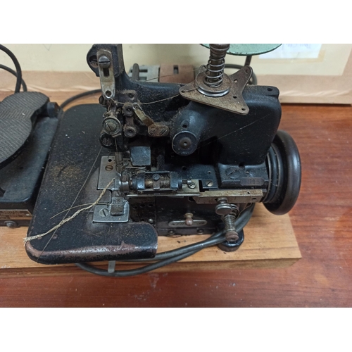 698 - A Vintage Tailers Sewing Machine