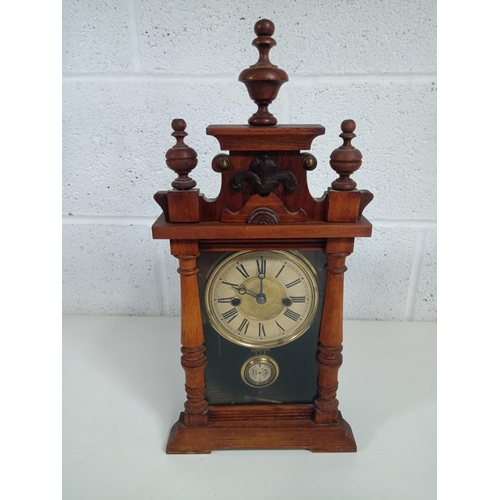 637 - A German carved wood mantle clock