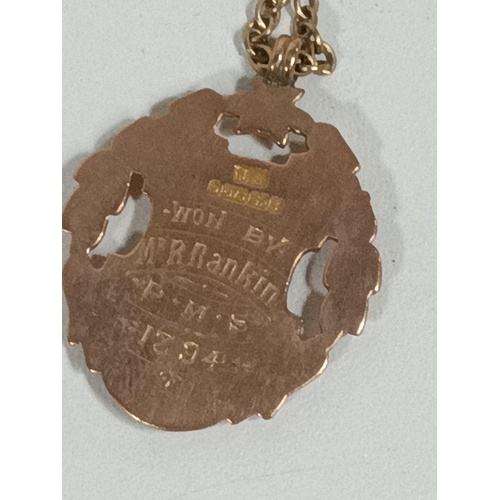 432 - A 9ct Gold Medallion, engraved 1894 to reverse, on a 9ct gold necklace chain. 12gms total weight