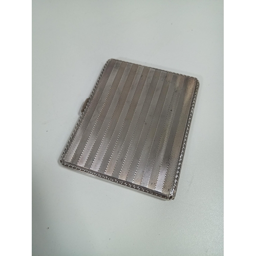 483 - An Engine Turned Hallmarked Silver Cigarette Case with Gilt Interior. Inscribed 130gms