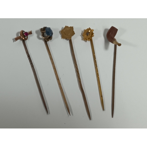 410 - A Collection of gold Tie pins. 1 x 15ct and 3 x 9ct.