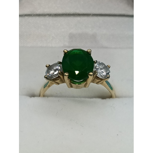 411 - A Hallmarked 9ct Yellow Gold Ring with Large Central Green Stone and Clear White Stones to Shoulders