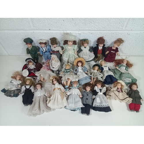 998 - A Collection of Porcelain Miniature Dolls