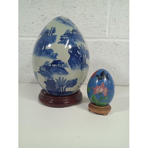 462 - A  China Blue and White Chinese Egg on Stand 24cm and Cloisonné Egg on Stand 11cm