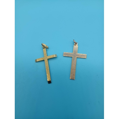 426 - A 9ct Yellow Gold Cross 1.1grams and another Hallmarked but tested 9ct Gold Cross 1.6grams