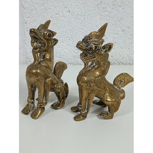 588 - A Pair of Burmese Chinthe Lions