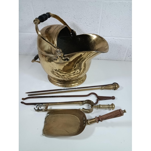 364 - A Brass Fireman's Helmet Coal Scuttle and Companion Set