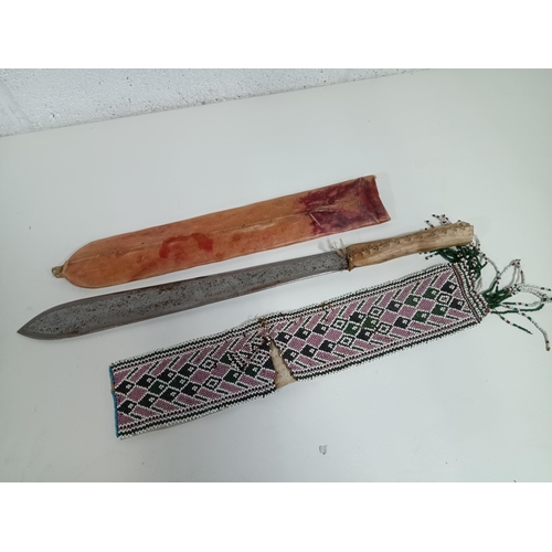 674 - A Hide Handled Knife (Very Sharp) and Beaded Skin (Damaged)