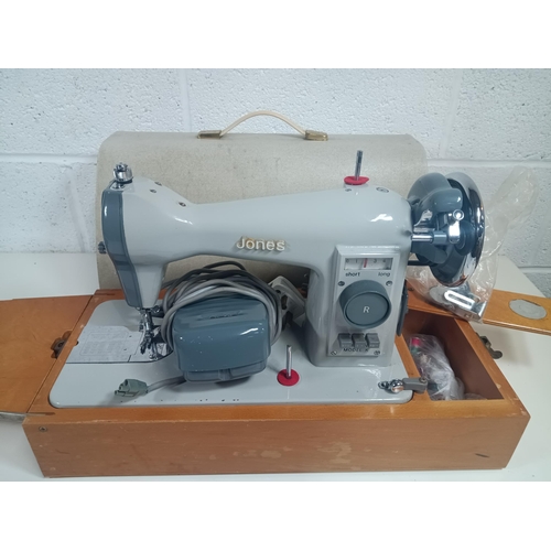 694 - A Vintage Jones Electric Sewing Machine in Case